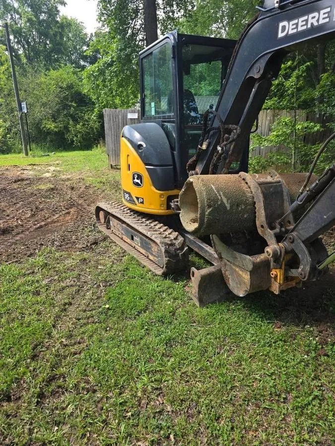Our John Deere mini excavator on a cleared lot